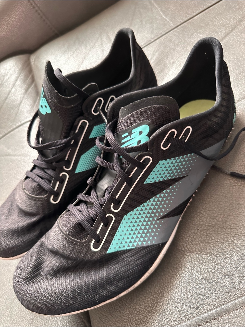 New Balance FuelCell SD100 v5 track spikes in black and cyber jade
